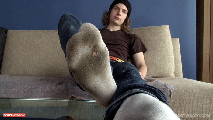 Scruffy twink wearing holey, dirty socks